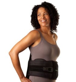 A woman wearing a back brace for her lower back.