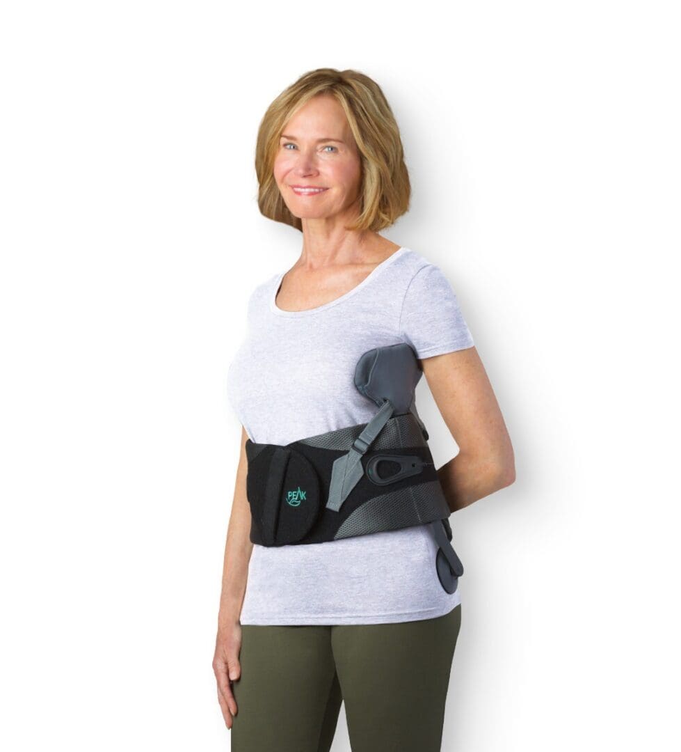 A woman wearing an upper back brace